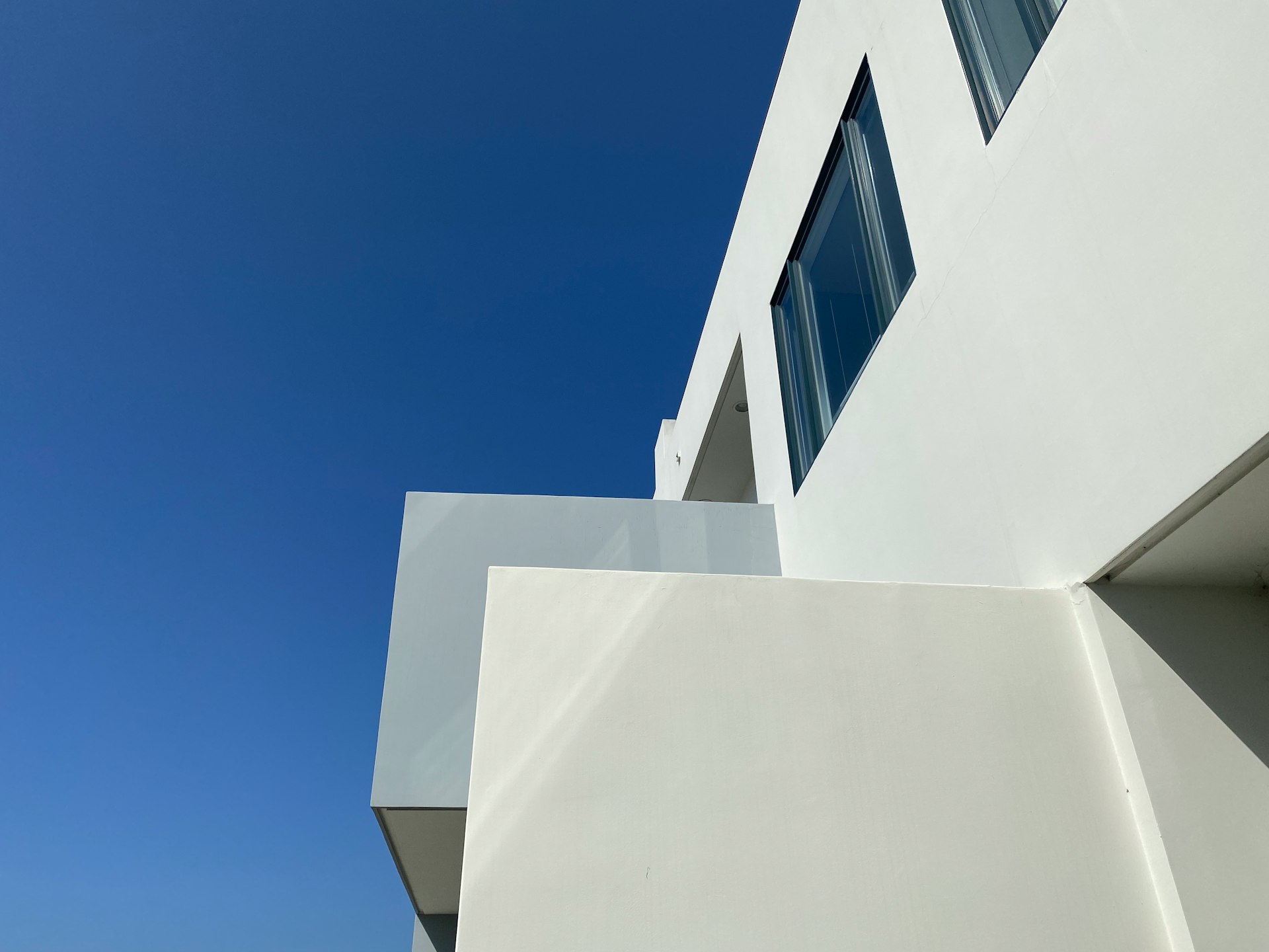 white concrete building under blue sky during daytime